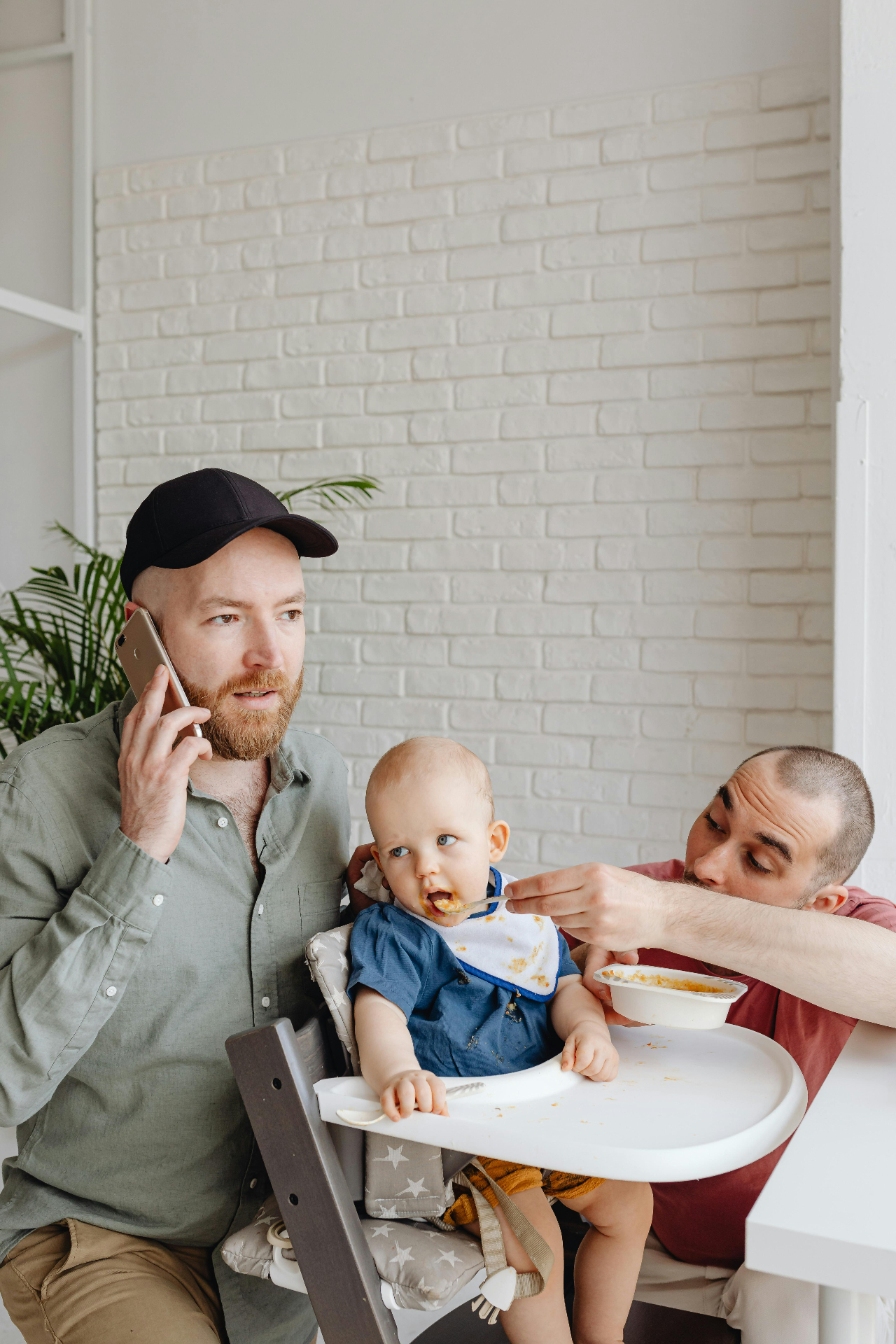 gay couple feeding a baby intimacy moms relationship marriage connection love support communication Katheryn Barton Uplift and Connect Counseling