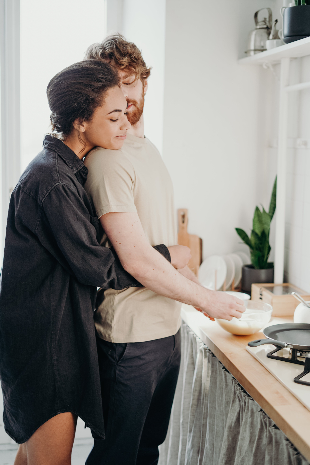 couple cooking together in kitchen Katheryn Barton Uplift and Connect Counseling communication connection love support moms